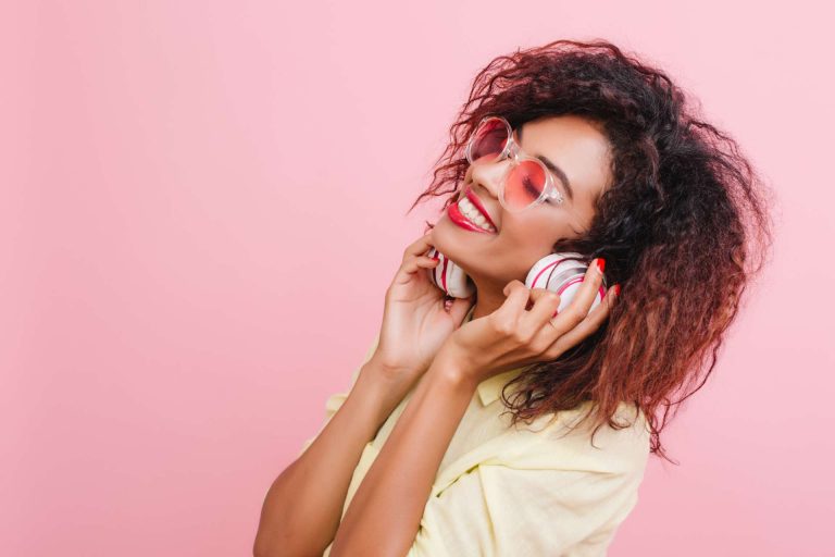 A woman listening to a hen party playlist