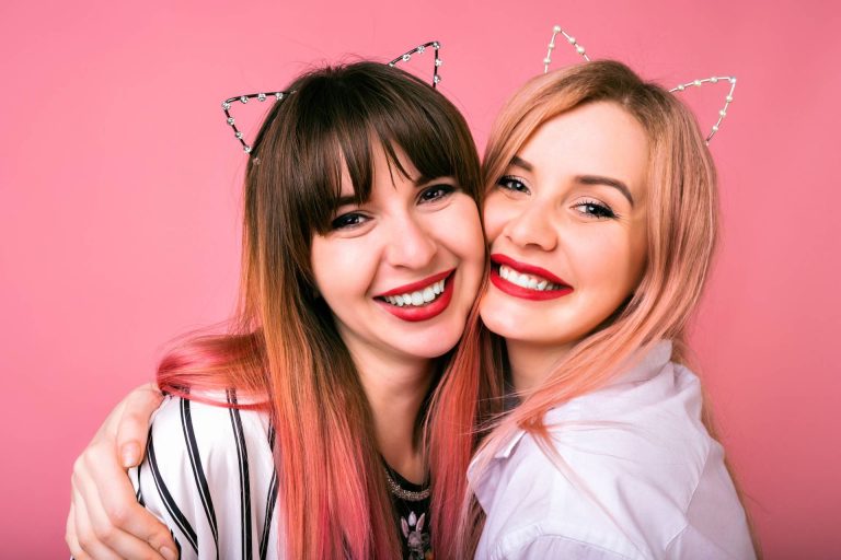 Two women smiling after playing My Best Memory With The Bride hen party game