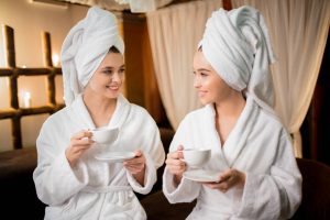 Pamper-loving hen party ideas like the two girls shown in the photo at a spa