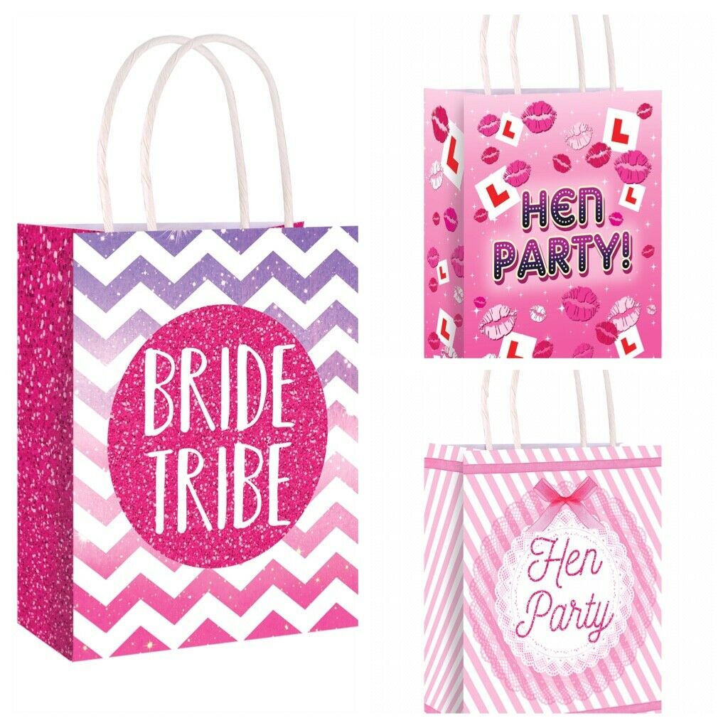 Paper hen party bags that say bride tribe or hen party on the front