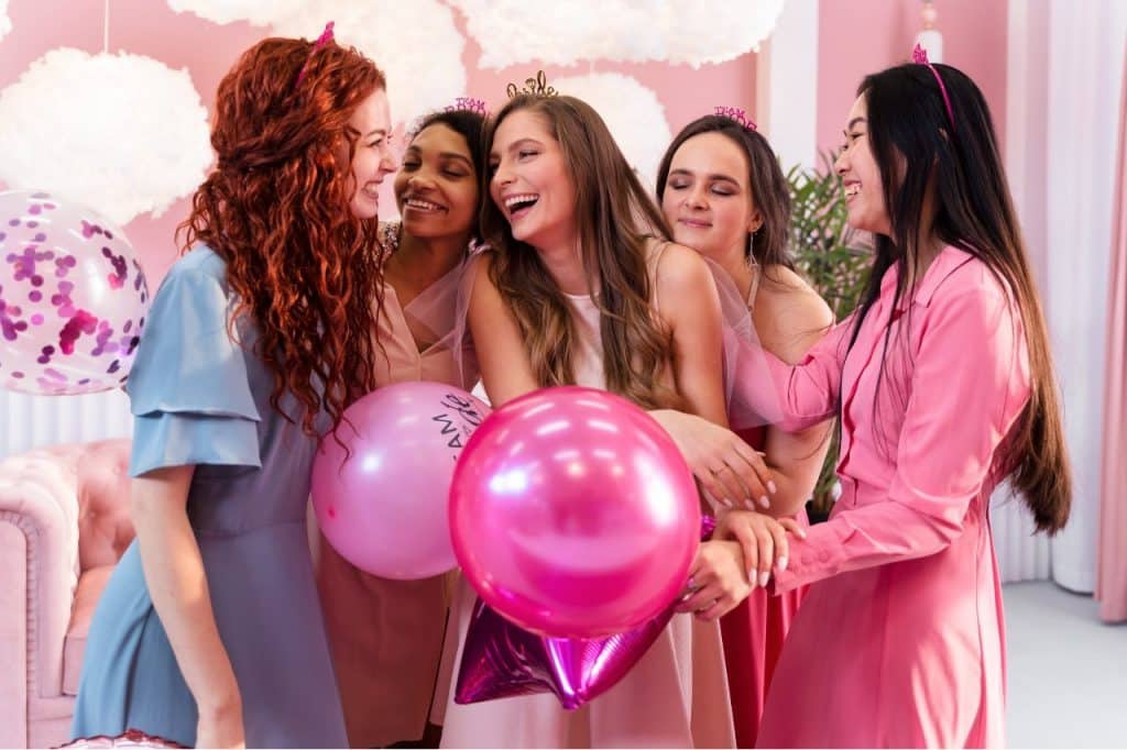 A group of women holding a hen party or kitchen tea or bachelorette party