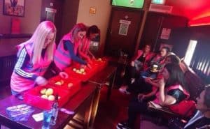 Girls playing The Cube hen party activity
