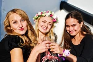 Three girls taking part in The Lovely Rose hen party activity