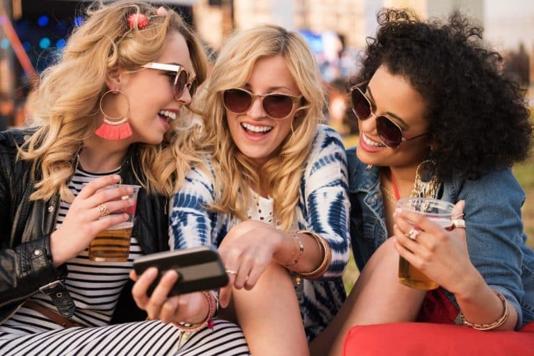 Three girls taking part in a hen party scavenger hunt