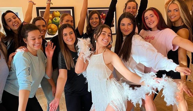 Hen party group posing during a dance class activity